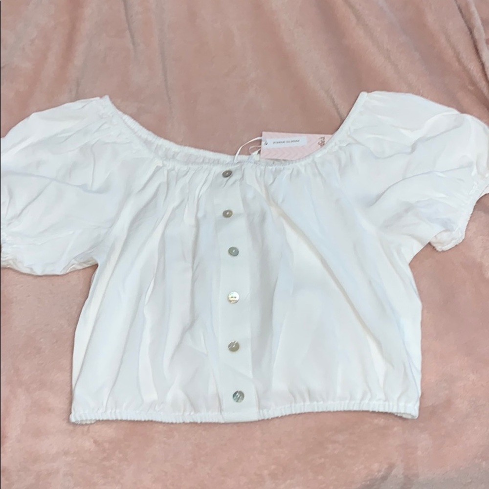 A white off the shoulder crop top
